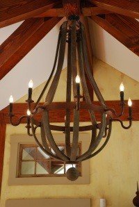 The massive Louis XVI chandelier made from reclaimed wine casks.